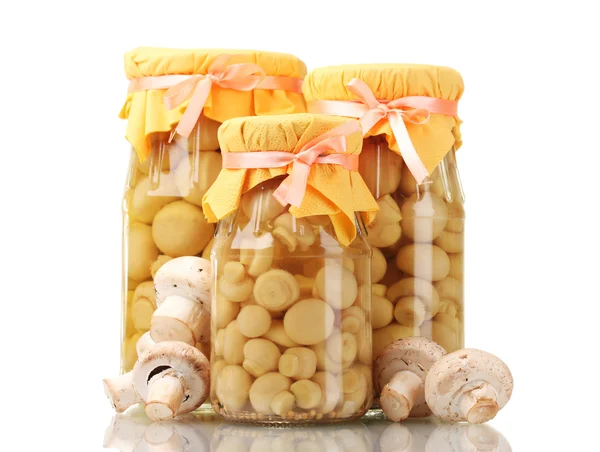 Delicious marinated mushrooms in the glass jars and raw champignons isolate — Stock Photo, Image