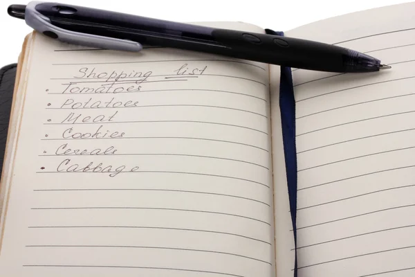 Список магазинов и крупный план ручки — стоковое фото