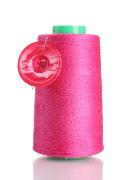 Pink bobbin thread with needle and pink button isolated on white — Stock Photo, Image