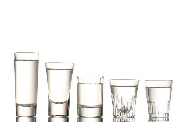 Veel glas wodka geïsoleerd op wit — Stockfoto