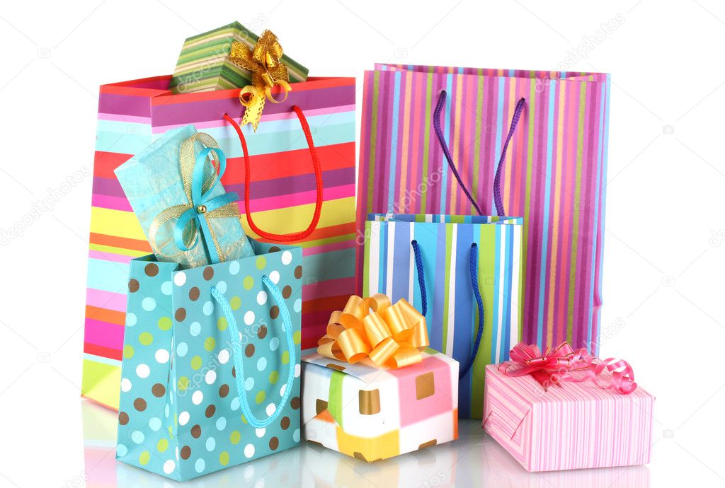 Bright gift bags and gifts isolated on white