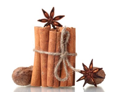 Cinnamon sticks, nutmeg and anise isolated on white clipart