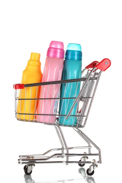 Shopping cart and detergent isolated on white — Stock Photo, Image