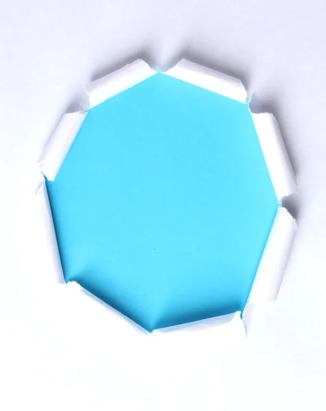 Papel rasgado com fundo azul — Fotografia de Stock