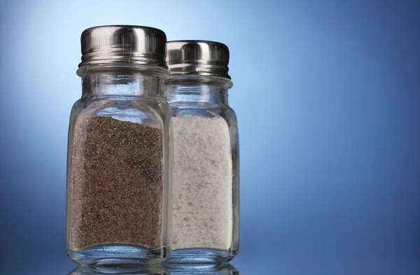 stock image Salt and pepper mills on blue