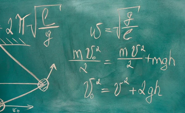 Formulas written on green chalkboard — Zdjęcie stockowe