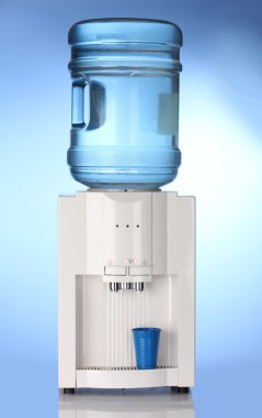 Electric water cooler on blue background clipart