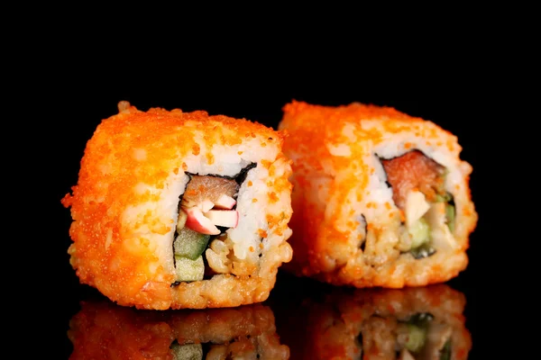 stock image Delicious sushi on black background