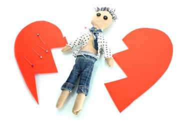 Voodoo doll boy on the broken heart isolated on white clipart