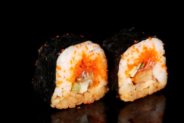 Delicious sushi on black background