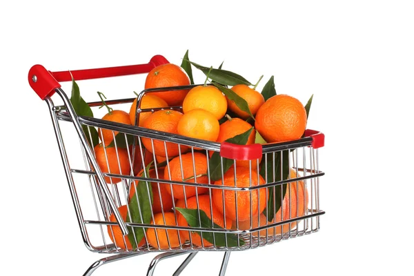 Ripe tasty tangerines in shopping cart isolated on white — Stock Photo, Image