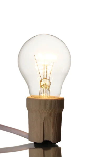 Зажженная лампочка, изолированная на белом — стоковое фото