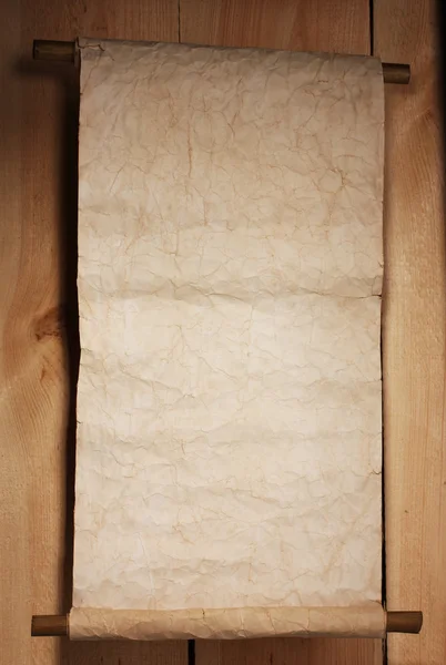 Viejo pergamino sobre fondo de madera —  Fotos de Stock