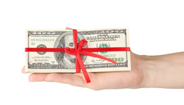 A lot of one hundred dollar bills tied red ribbon in hand isolated on white — Stock Photo, Image