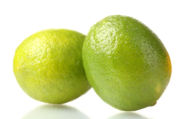 Due lime mature isolate su bianco — Foto Stock