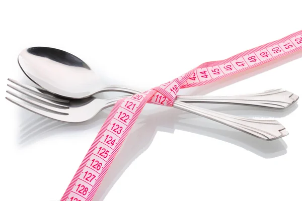 Fork, spoon and measuring tape isolated on white — Stock Photo, Image