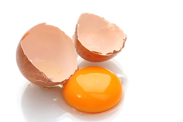 Brown egg with yolk isolated on white — Stock Photo, Image