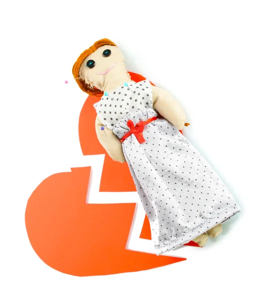 Voodoo doll girl on the broken heart isolated on white — Stock Photo, Image