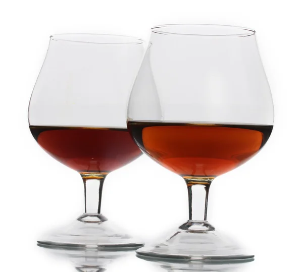 stock image Two glass of cognac isolated on white