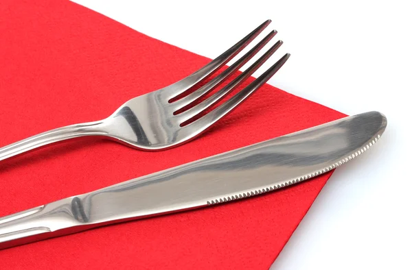 Widelec i nóż w czerwonego sukna na białym tle — Zdjęcie stockowe