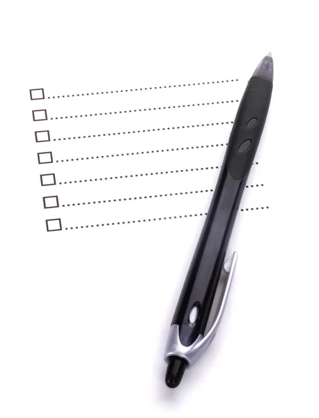 Контрольный лист и крупный план ручки — стоковое фото