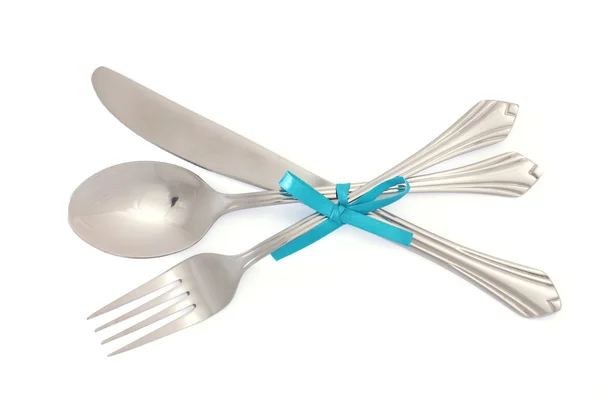 Silver fork and spoon, knife tied with a blue ribbon isolated on white — Stock Photo, Image