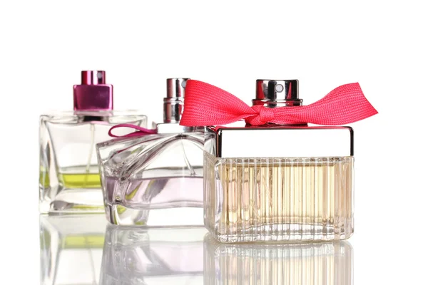 Tres frascos de perfume aislados en blanco —  Fotos de Stock