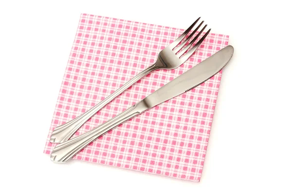 Fork and knife in a plaid cloth isolated on white — Stock Photo, Image