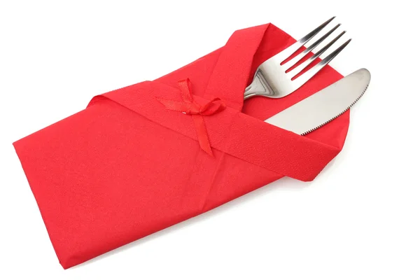 Vork en mes in een rode doek met een boog geïsoleerd op wit — Stockfoto