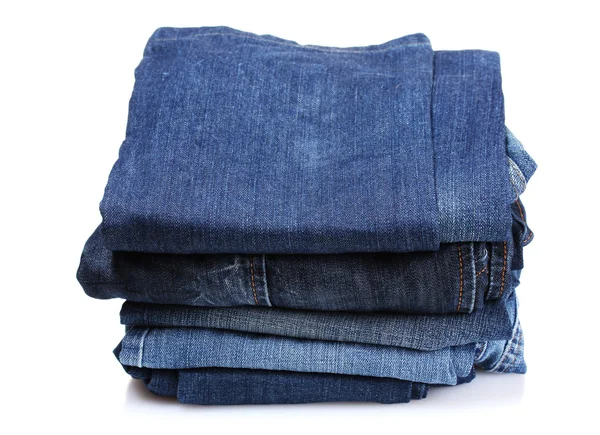 Spousta modrých džínů izolovaných na bílém — Stock fotografie