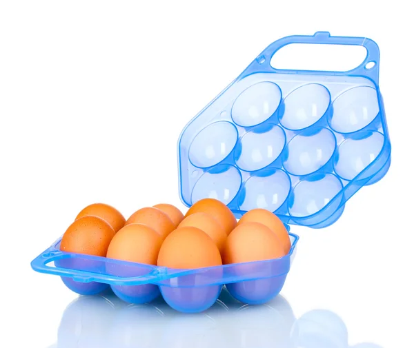 Huevos en caja de plástico azul aislados en blanco — Foto de Stock