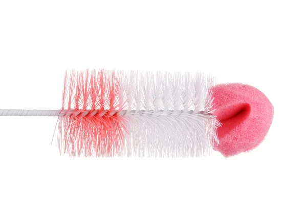Escova de limpeza rosa isolado no branco — Fotografia de Stock