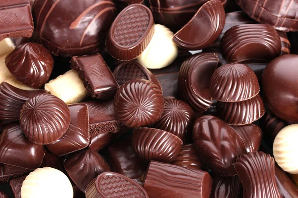 Muitos doces de chocolate diferentes closeup — Fotografia de Stock