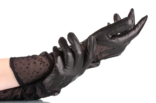 Mãos femininas em luvas de couro preto isolado no branco — Fotografia de Stock