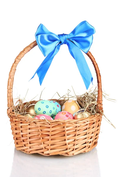 Colorful Easter eggs in the basket with a blue bow isolated on white — Stock Photo, Image