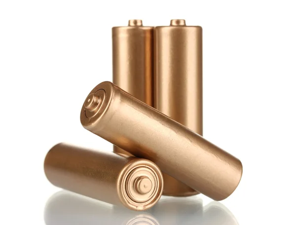 Čtyři zlaté baterie izolovaných na bílém — Stock fotografie