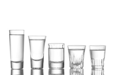 Many glass of vodka isolated on white clipart