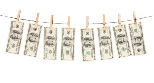 A lot of one hundred dollar bills is hanging on a rope — Stock Photo, Image