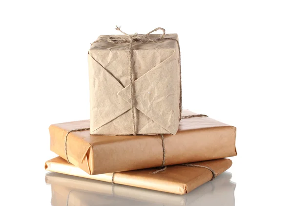 Three parcels arranged in stack isolated on white — Stock Photo, Image