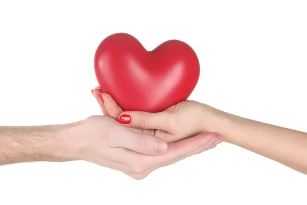 Man och kvinna med rött hjärta i händerna isolerad på vit — Stockfoto
