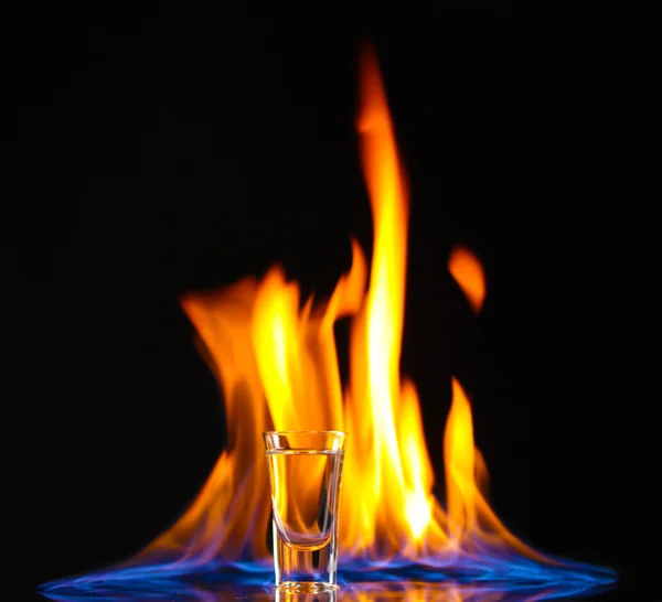 Flaming vodka on black background — Stock Photo, Image