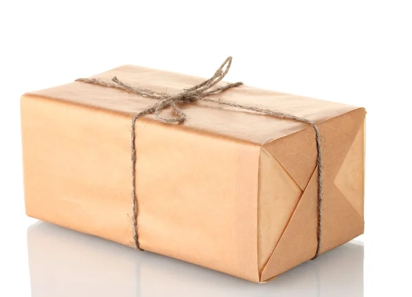 Parcel wrapped in brown paper tied with twine isolated on white — Stock Photo, Image