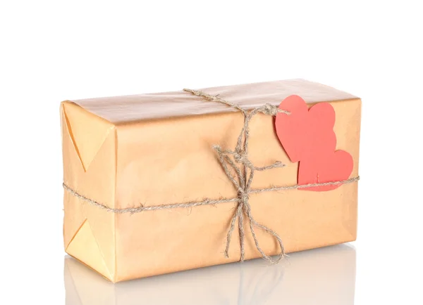 Parcel with blank heart-shaped label isolated on white Royalty Free Stock Images