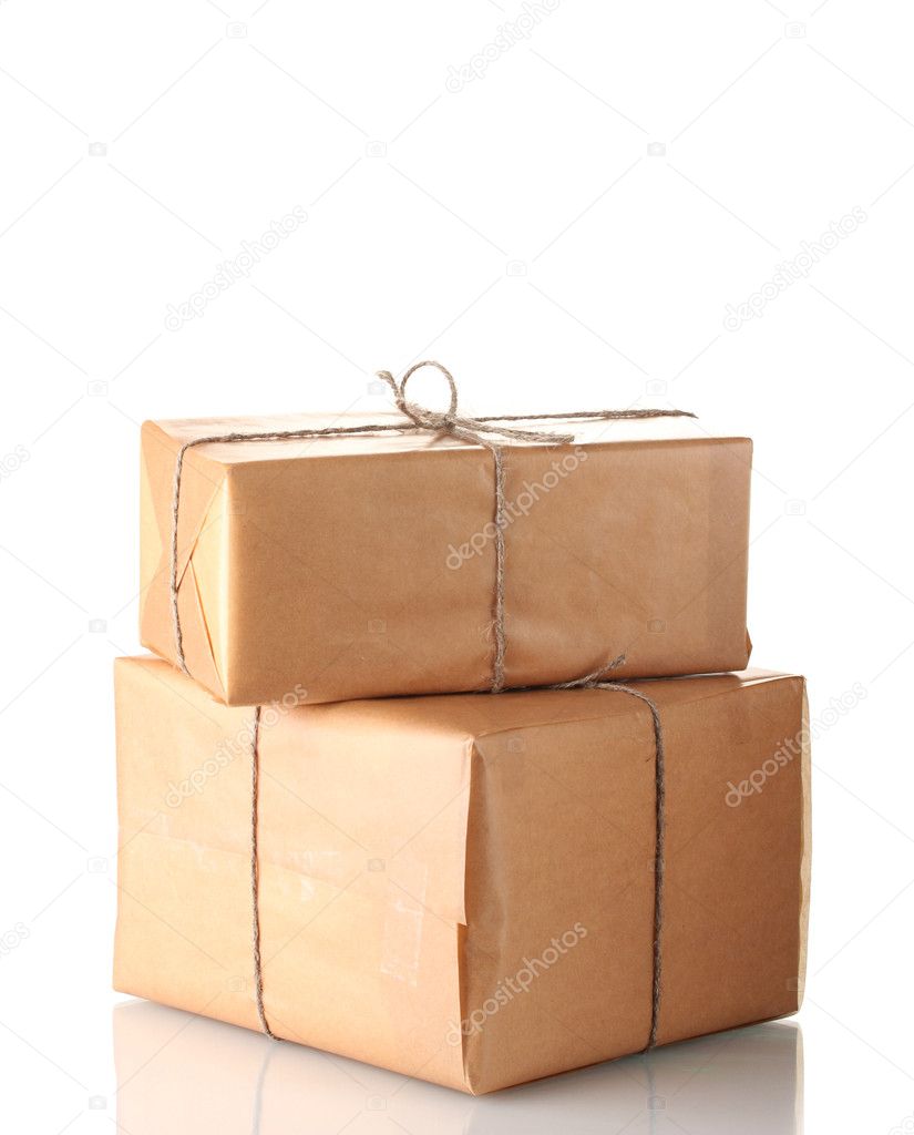 Two parcels wrapped in brown paper tied with twine arranged in stack isolat