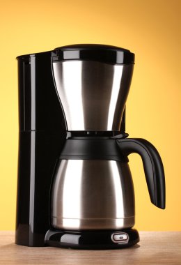 Coffee maker on yellow background clipart