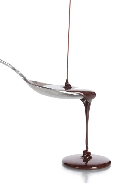 Сhocolate poured into a spoon isolated on white — Stock Photo, Image