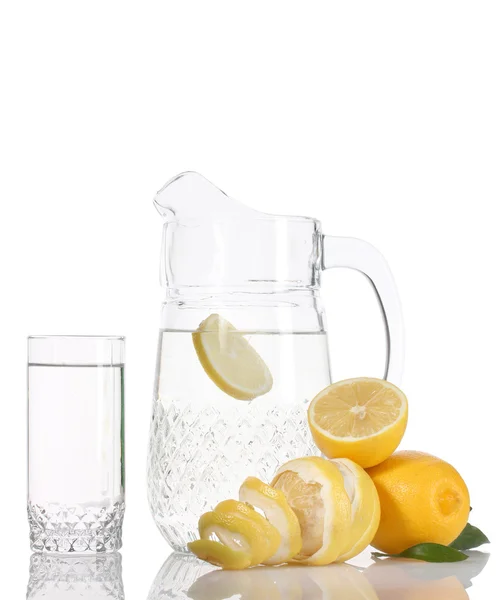 Pitcher and glass of lemonade and lemons isolated on white — Stock Photo, Image
