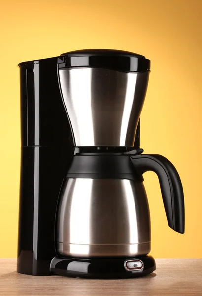 Coffee maker on yellow background — Stock Photo, Image