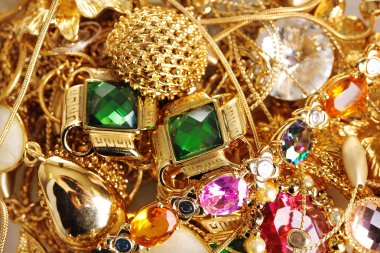 Various gold jewellery closeup clipart