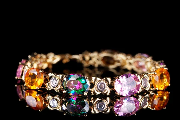 Beautiful bracelet with precious stones on black background — Stock Photo, Image